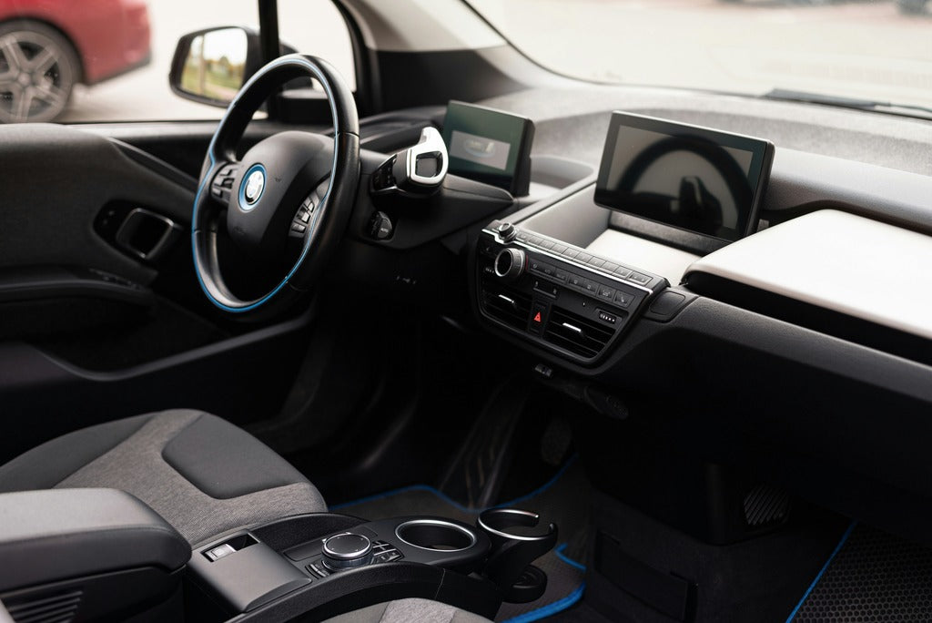 Interior of car with steering wheel and dashboard